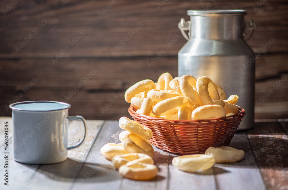 Biscuit, manioc flour cookies arranged on rustic wooden surface, selective focus. Biscuit, manioc flour cookies arranged on rustic wooden surface, selective focus.