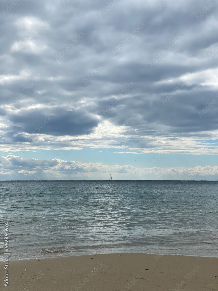 boat, clouds over the sea
