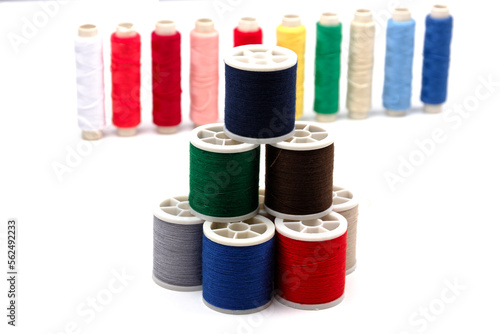 group of sewing spools isolated on white background with real shadows