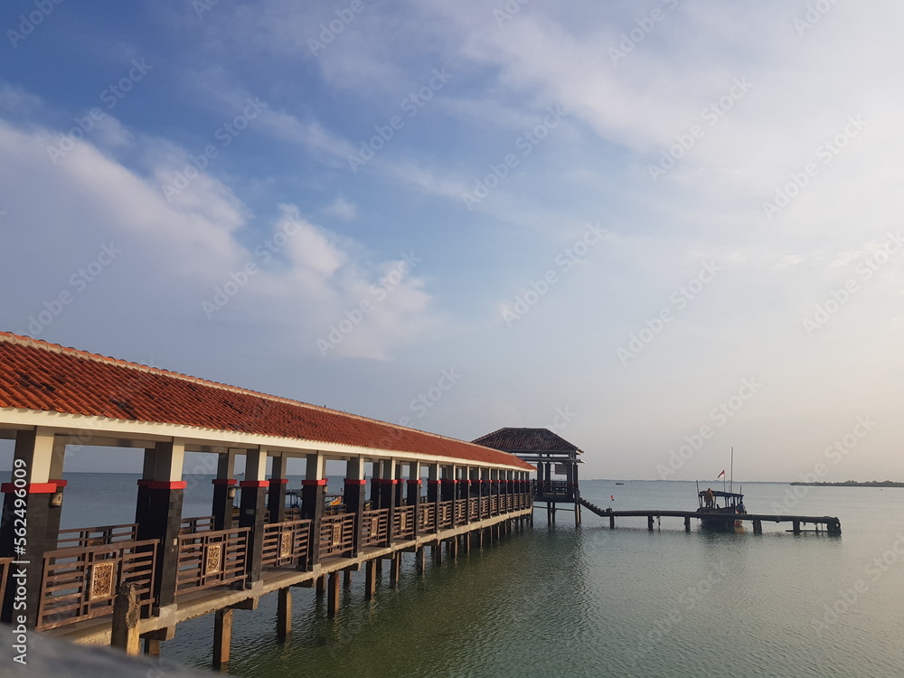 A pier for anchor ships and small boats on a beach called Tirta Samudera Beach or Bandengan Beach