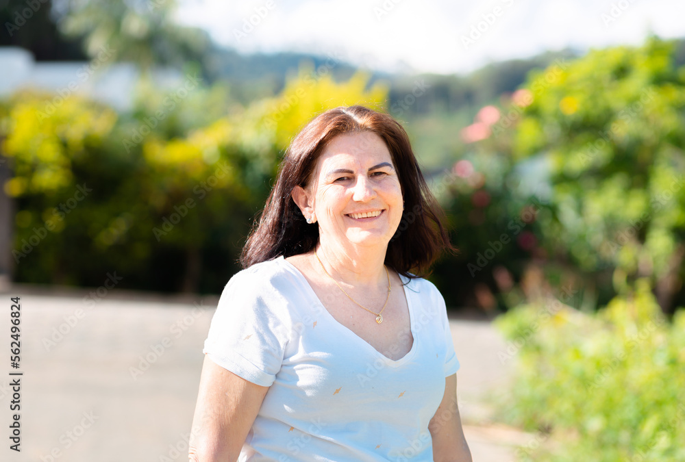 Brazilian woman happy and smiling and looking at camera in the street Brazilian woman happy and smiling and looking at camera in the street