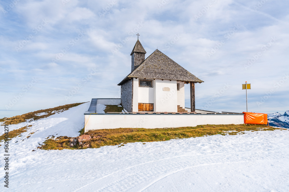 A small chapel on snowy Hahnenkamm mountain in Kitzbuhel, Austria
