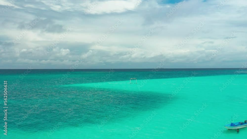 Aerial view of Swings over turquoise sea water in Fulidhoo island on Maldives. Landscape seascape and concept travel vacation.