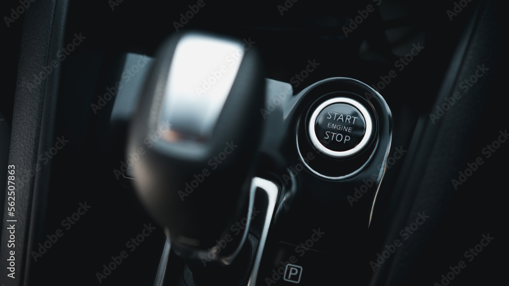 Close up Start Engine and Stop button. The power-on/off button inside a car.