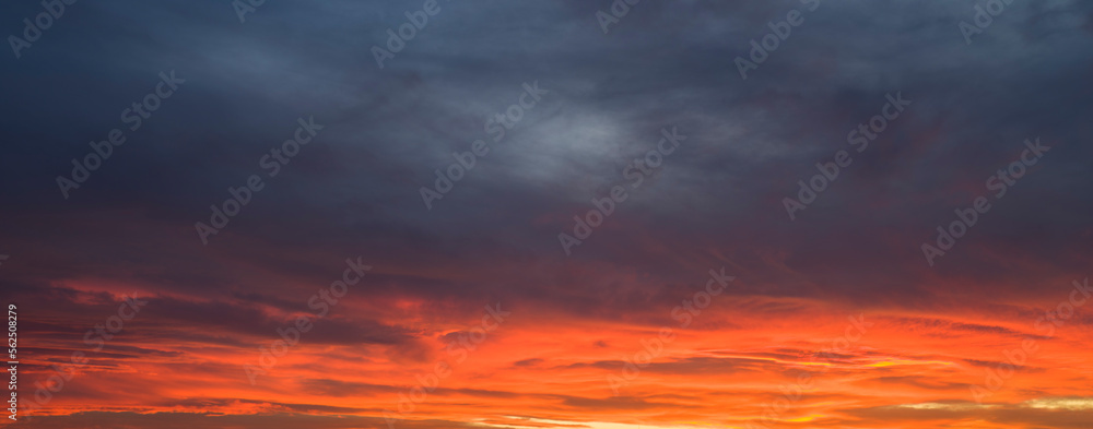 Dramatic blue sky panorama at orange sunset