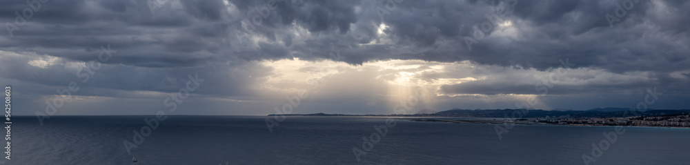 Dramatic Cloudy Sky with Sunrays on the Sea Coast in Nice, France. Cloudscape Background Panorama