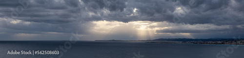 Dramatic Cloudy Sky with Sunrays on the Sea Coast in Nice, France. Cloudscape Background Panorama