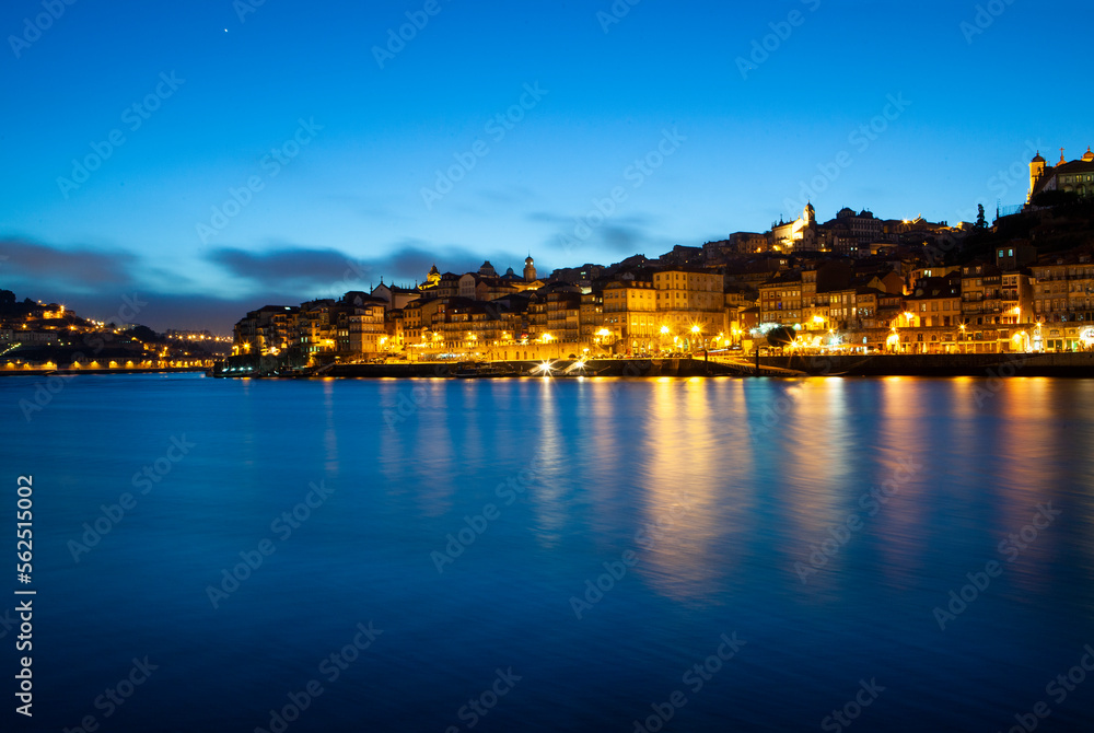 Skyline of Porto in Portugal illuminated at dusk over the River Douro