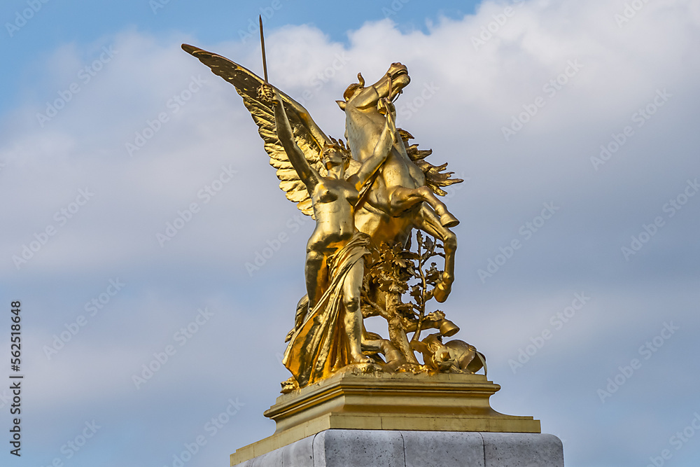 Obraz premium Pont Alexandre III (1896) - arch bridge spanning river Seine in Paris. Alexandre III bridge is most ornate, extravagant bridge in the city. Paris, France.