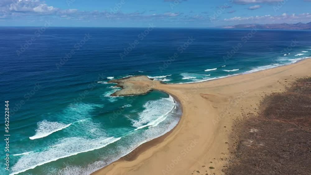 Amazing Cofete beach with endless horizon. Volcanic hills in the background and Atlantic Ocean. Cofete beach, Fuerteventura, Canary Islands, Spain. Playa de Cofete, Fuerteventura, Canary Islands. Amazing Cofete beach with endless horizon. Volcanic hills in the background and Atlantic Ocean. Cofete beach, Fuerteventura, Canary Islands, Spain. Playa de Cofete, Fuerteventura, Canary Islands.