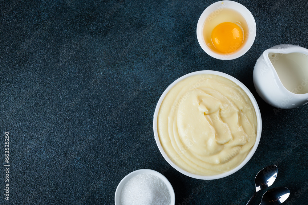 Glass jar with vanilla pudding. Custard cream. Traditional cream Glass jar with vanilla pudding. Custard cream. Traditional cream
