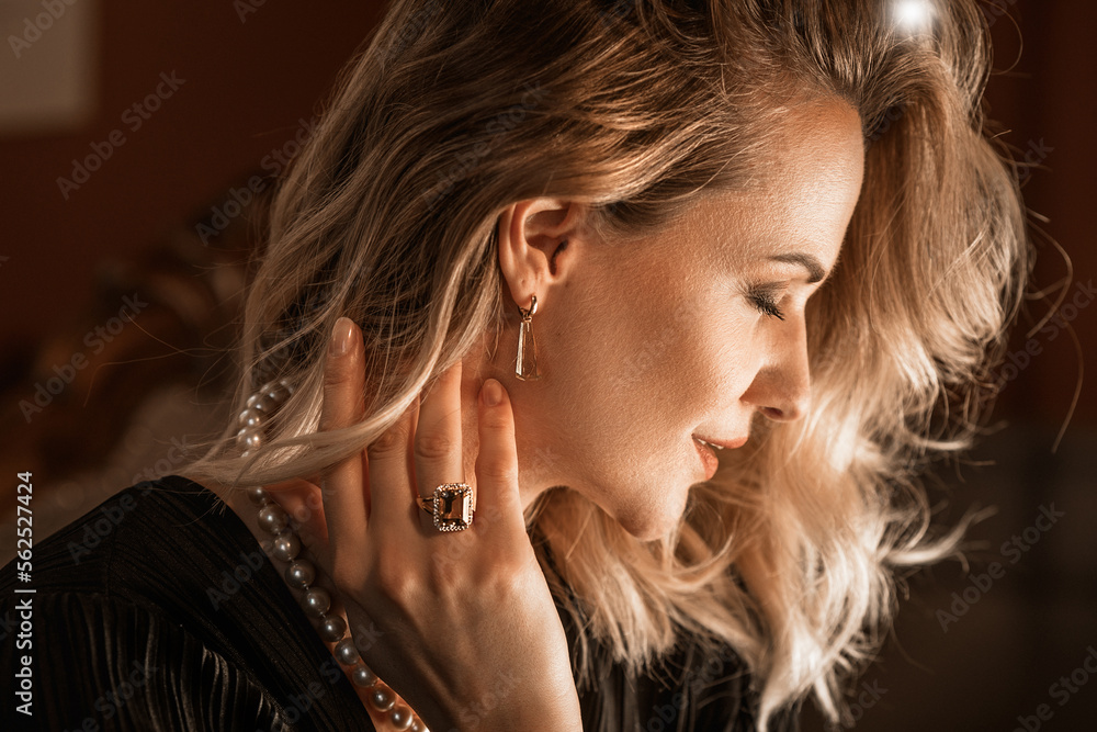 Romantic portrait of a girl dressed in an elegant dress and expensive jewelry Romantic portrait of a girl dressed in an elegant dress and expensive jewelry
