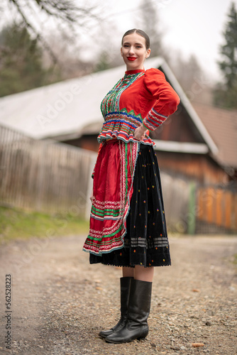 Young beautiful slovak woman in traditional dress. Slovak folklore