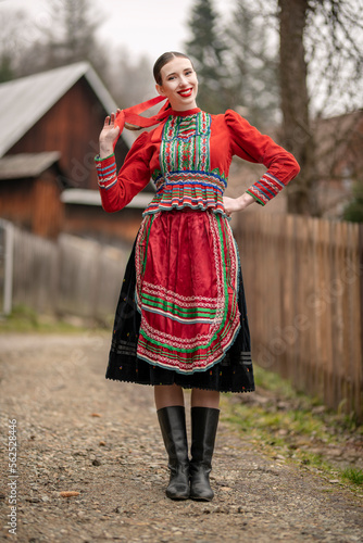 Young beautiful slovak woman in traditional dress. Slovak folklore