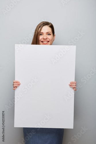 Obraz na płótnie Smiling woman holding big empty banner. w salonie