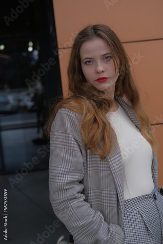 Business women in the elegant classic clothes. City portrait of the girl