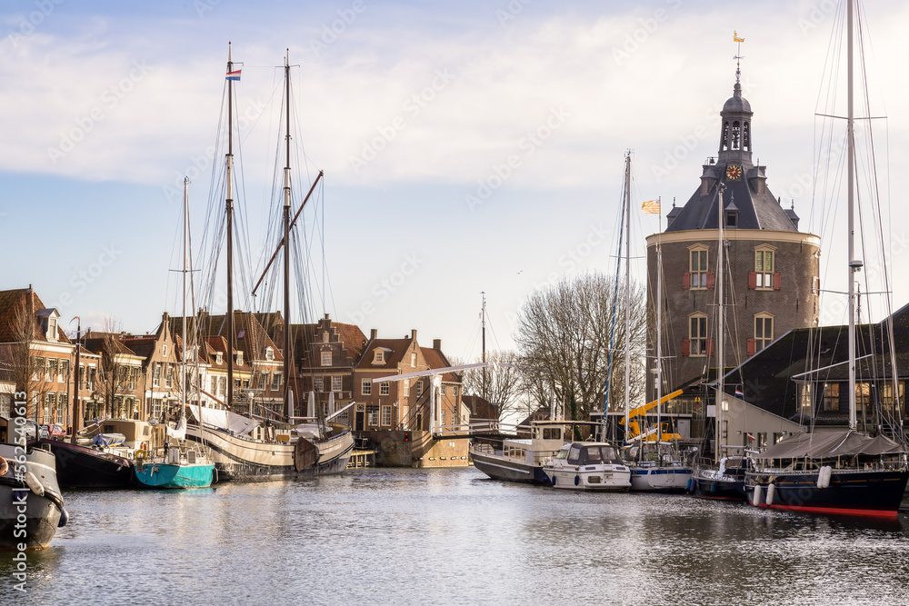 Old harbor of the historic medieval city of Enkhuizen with the city gate De Drommesaris.