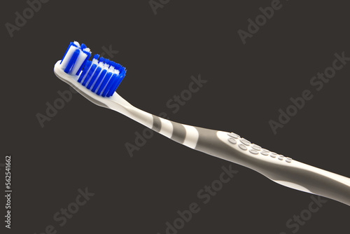 toothbrush with toothpaste for cleaning teeth on a dark background. health care. health items