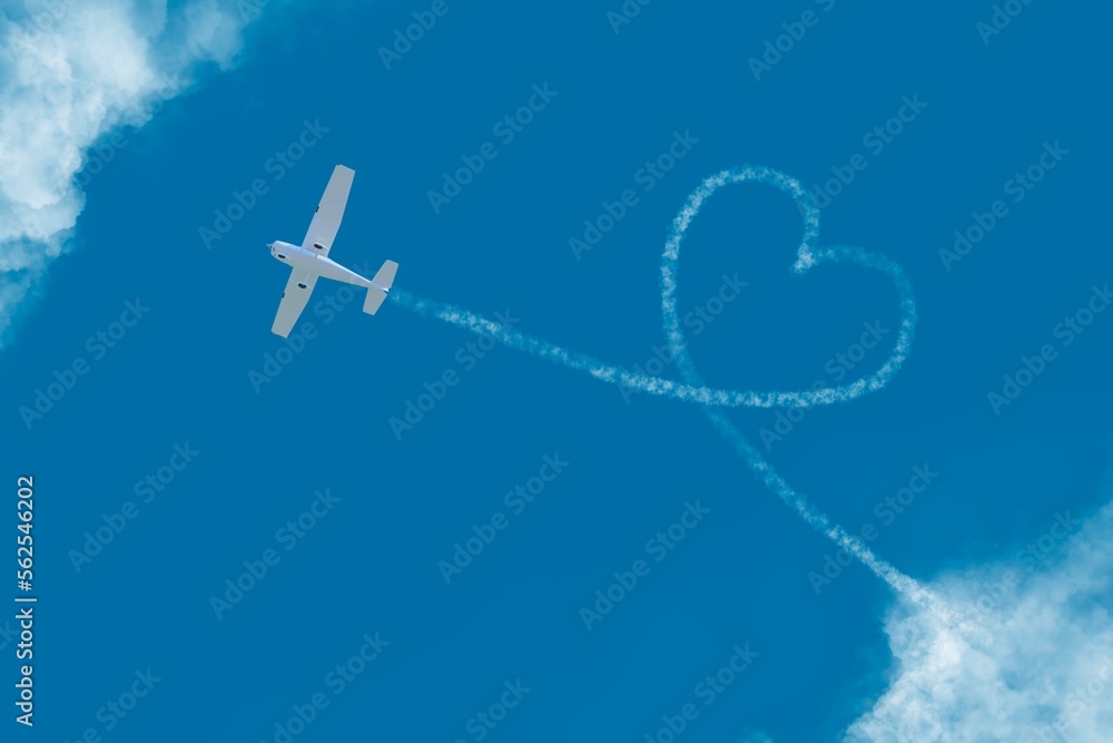 flying plane among the clouds love heart sign flying plane among the clouds love heart sign