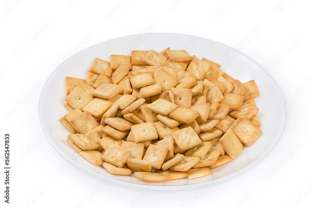 Salty crackers square shape on white dish on white background Salty crackers square shape on white dish on white background