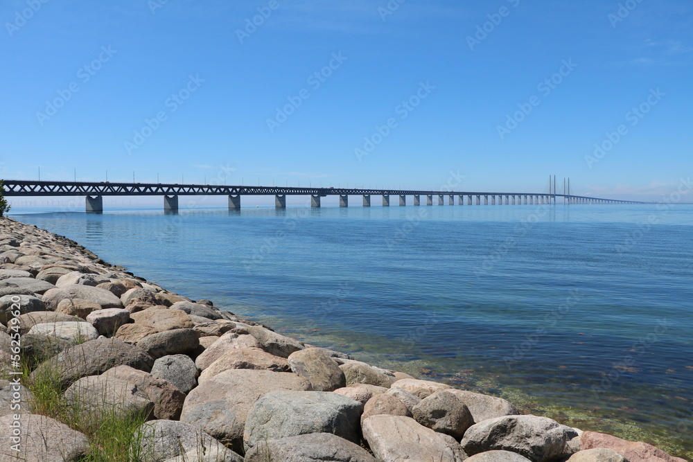 Holidays at coastal shore around Malmö on the Baltic Sea, view to Öresund Bridge, Sweden