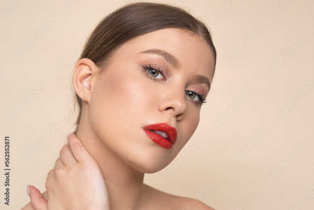 Beauty female with red lips on light brown background. Beauty female with red lips on light brown background.