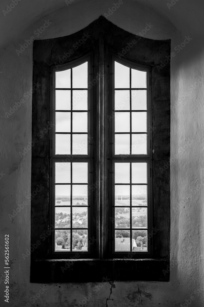 Ancient wooden window of a medieval castle. Background. Black and white. Ancient wooden window of a medieval castle. Background. Black and white.