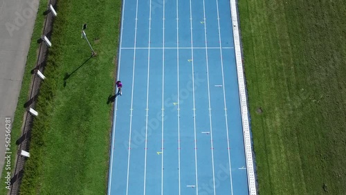 An athletic track and a stadium where athletes can train, between the hills, the woods and the city.