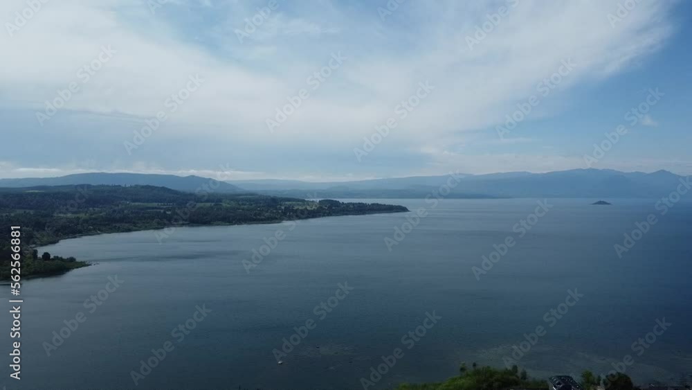 A look at the lake and the city from above. In the distance you can see the volcano and a clear sky. A look at the lake and the city from above. In the distance you can see the volcano and a clear sky.