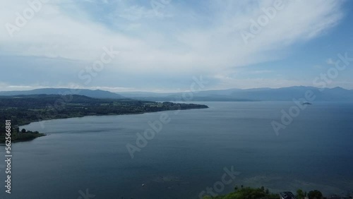 A look at the lake and the city from above. In the distance you can see the volcano and a clear sky.