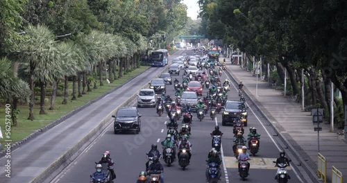Traffic on Jalan Merdeka Barat is dominated by motorcyclists.