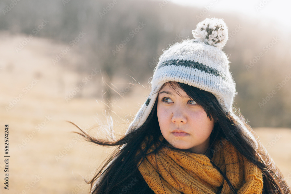 Woman in toboggan around sunset Woman in toboggan around sunset