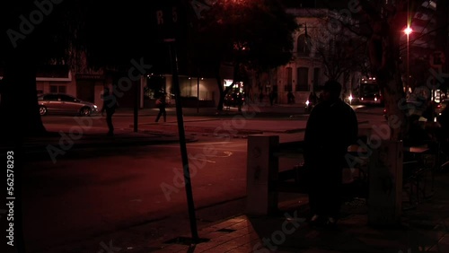 Movement of Cars and People at Night in La Cañada, Symbol of the city of Cordoba, Argentina. photo