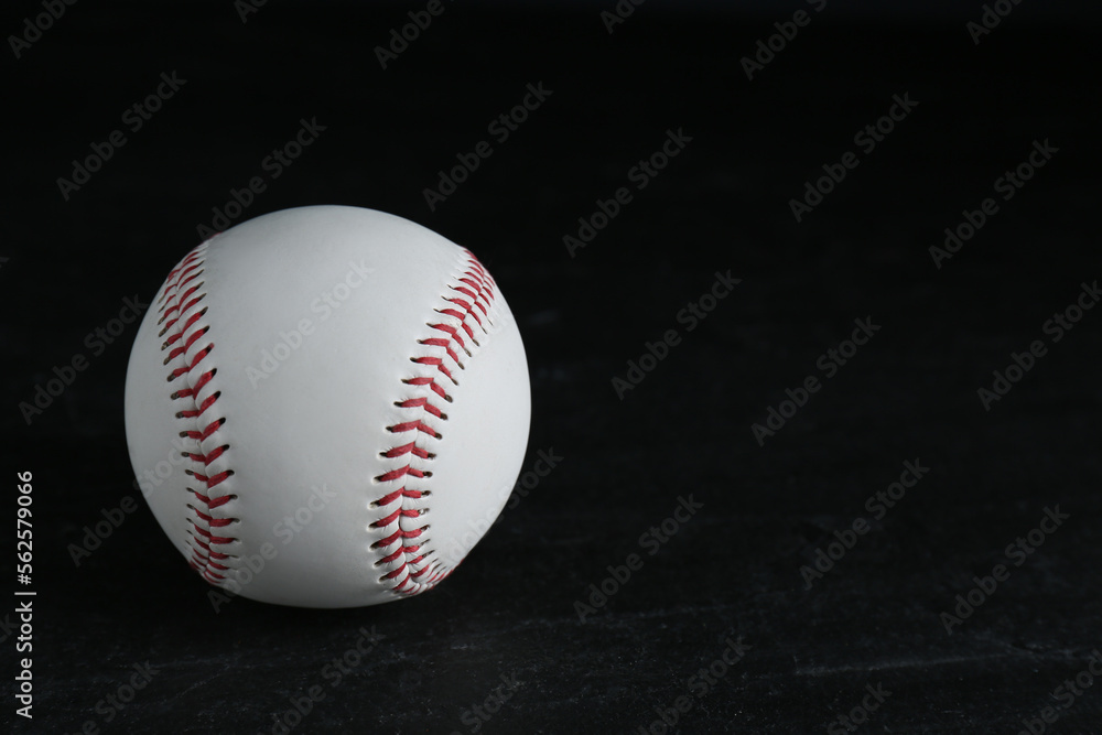 Baseball ball on black background, space for text. Sports game Baseball ball on black background, space for text. Sports game