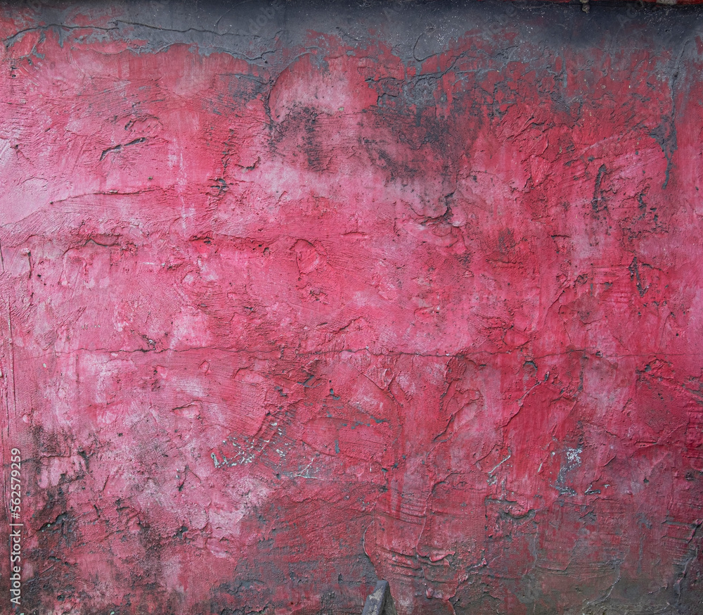 Red painted concrete wall with stains grunge texture