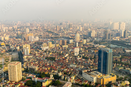 Elevated view of a congested city with high rise buildings and tightly packed housing at Hanoi in Vietnam
