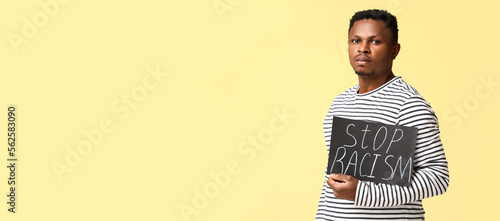 African-American man holdin...