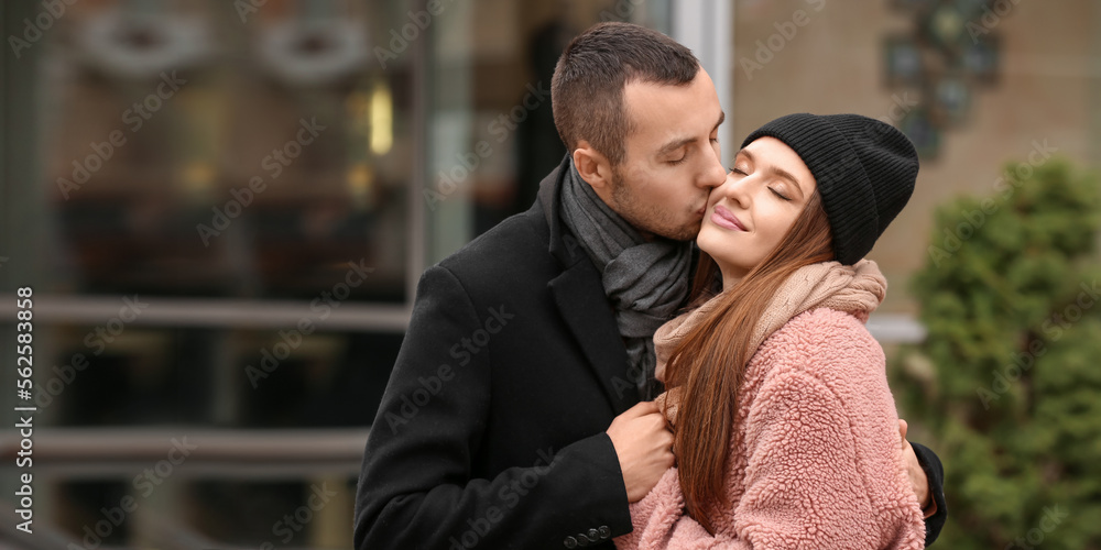 Fototapeta premium Portrait of happy young couple on romantic date outdoors