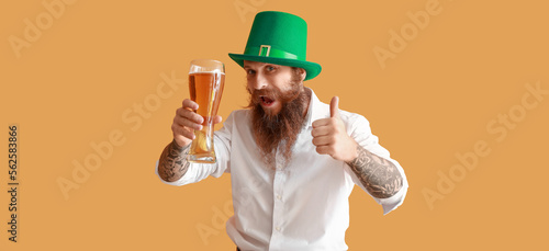 Tattooed bearded man with g...