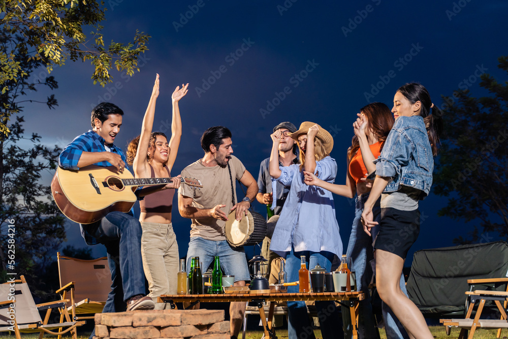 © Kawee - Group of diverse friend having outdoors camping party together in tent. © Kawee - Group of diverse friend having outdoors camping party together in tent.
