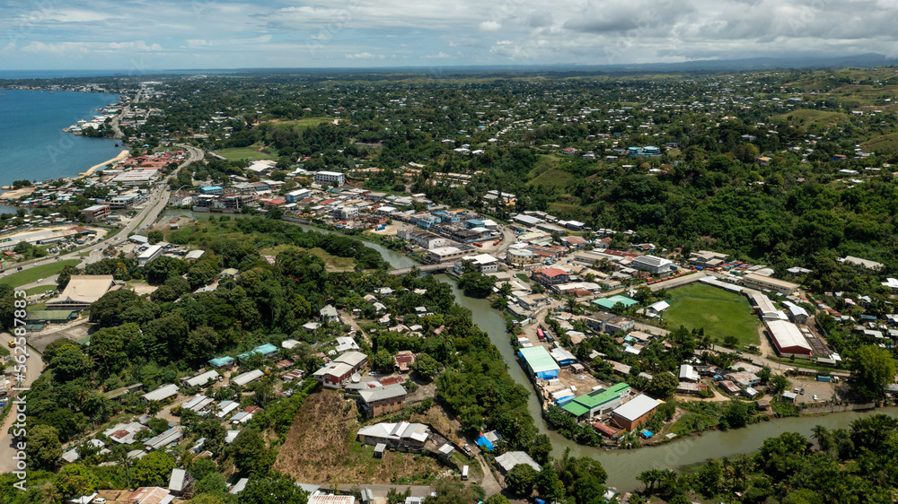 Winding river separating China Town, Honiara city and suburbia.