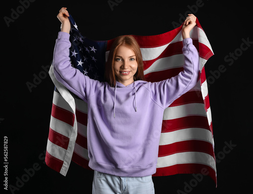 Young redhead woman with US...