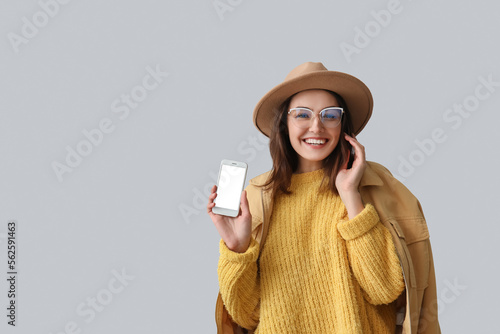 Young woman in hat with mob...