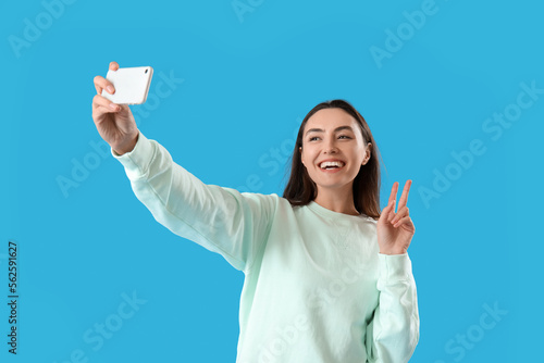 Young woman with mobile pho...