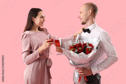Young couple with flowers a...