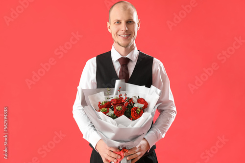 Young man with bouquet of f...