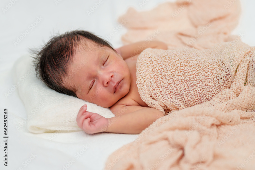 newborn baby sleeping in blanket on bed newborn baby sleeping in blanket on bed