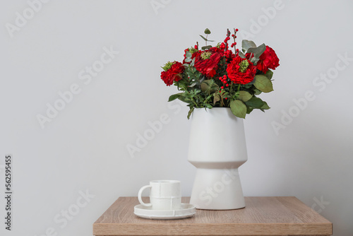 Wallpaper Mural Vase with flowers for Valentine's Day and cup of coffee on table near light wall Torontodigital.ca
