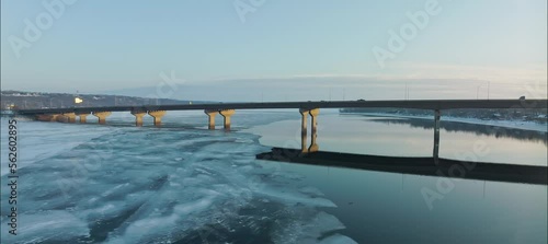 Ascending Aerial Orbit Of 94 Bridge Over Frozen St. Croix River In Hudson WI photo