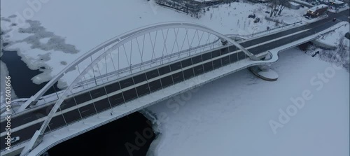 Aerial View Of Man Running Across Snow Covered Lowry Bridge In NE Minneapolis photo